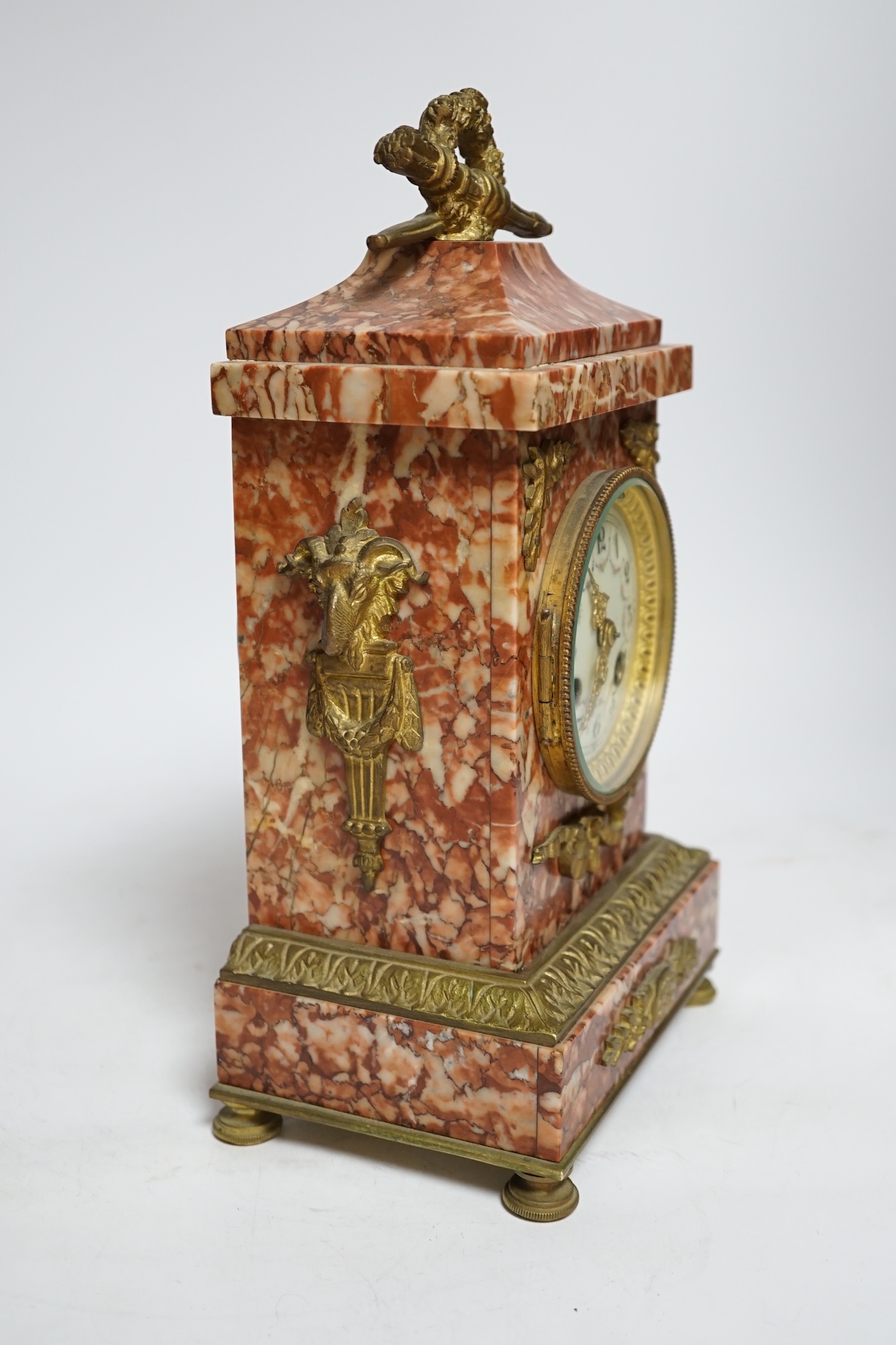 A mid-19th century rouge marble mantel clock, L. Marti et Cie Medaille D’argent two train movement, striking on a bell (bell missing), 29.5cm